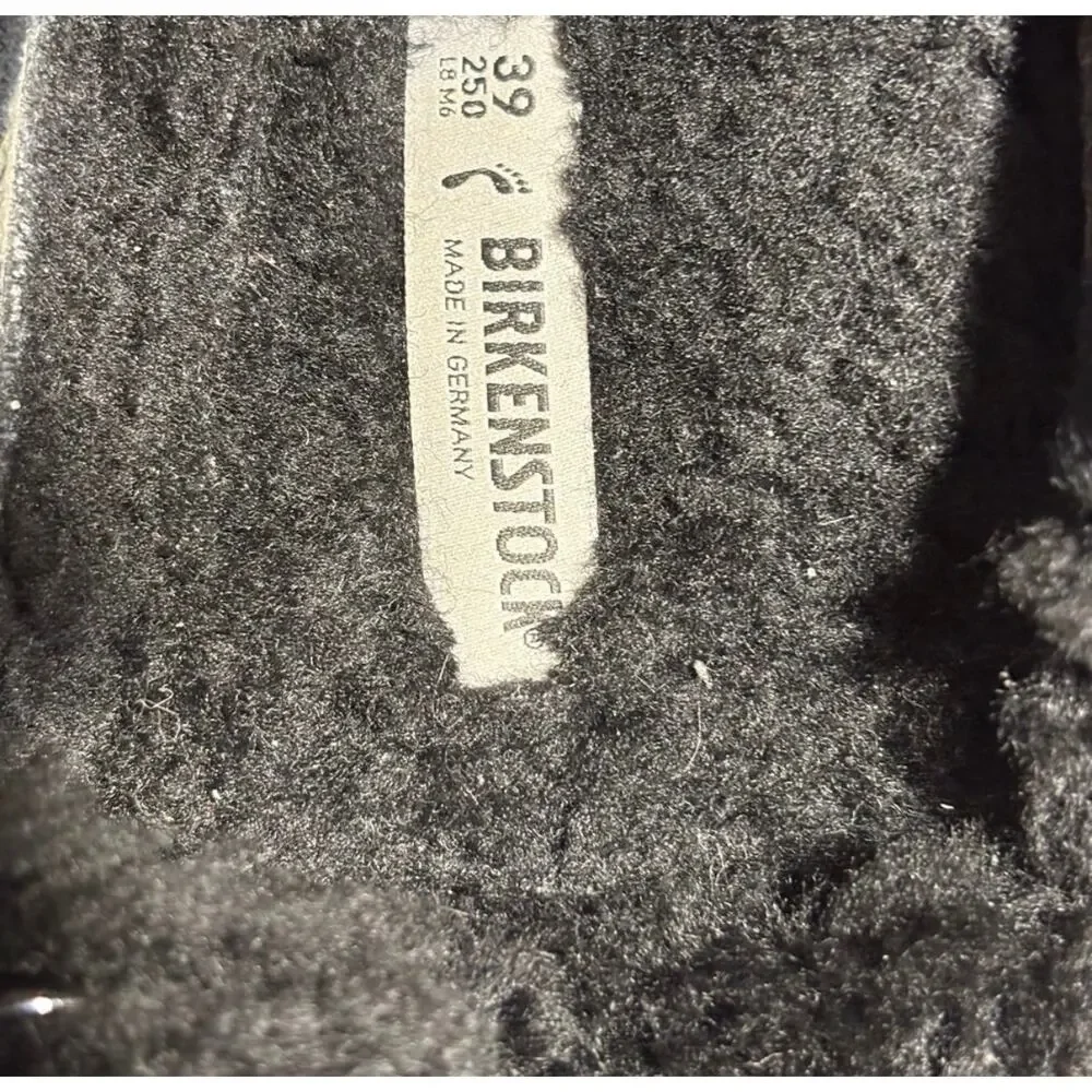 Birkenstock black shearling Sandals.